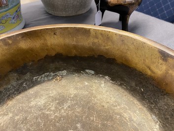 A large Chinese bronze tripod censer with chilong handles, Xuande mark, 18/19th C.