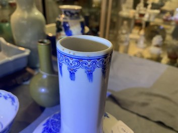 A Chinese wucai rouleau vase and a blue, white and copper-red vase, 19/20th C.