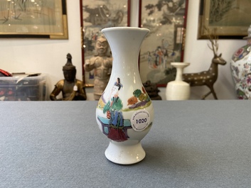 A Chinese famille rose vase with a man and a woman in a garden, Yongzheng