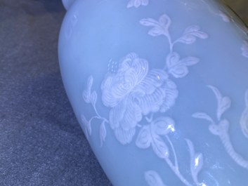 A Chinese monochrome blue censer and a white slip-decorated celadon vase, 18/19th C.