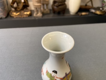 A Chinese famille rose vase with a man and a woman in a garden, Yongzheng