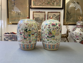 A pair of Chinese famille rose 'antiquities' jars and covers, 19th C.