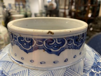 A Chinese gilt-heightened blue and white vase and cover, Kangxi/Yongzheng