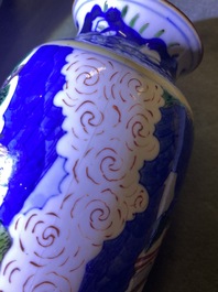 A Chinese wucai rouleau vase and a blue, white and copper-red vase, 19/20th C.