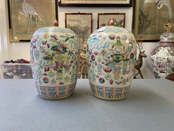 A pair of Chinese famille rose 'antiquities' jars and covers, 19th C.