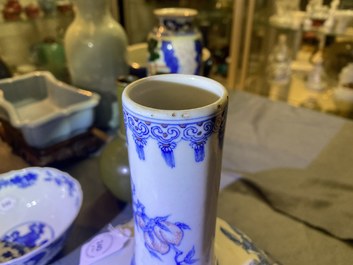 A Chinese wucai rouleau vase and a blue, white and copper-red vase, 19/20th C.
