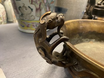 A large Chinese bronze tripod censer with chilong handles, Xuande mark, 18/19th C.