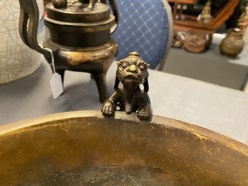 A large Chinese bronze tripod censer with chilong handles, Xuande mark, 18/19th C.