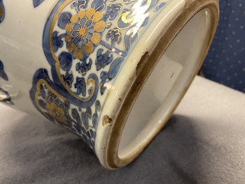 A Chinese gilt-heightened blue and white vase and cover, Kangxi/Yongzheng