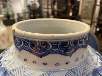 A Chinese gilt-heightened blue and white vase and cover, Kangxi/Yongzheng