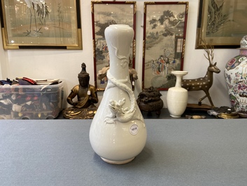 A Chinese Dehua blanc de Chine vase with applied dragon, Kangxi/Yongzheng