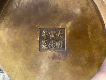 A large Chinese bronze tripod censer with chilong handles, Xuande mark, 18/19th C.
