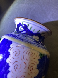 A Chinese wucai rouleau vase and a blue, white and copper-red vase, 19/20th C.
