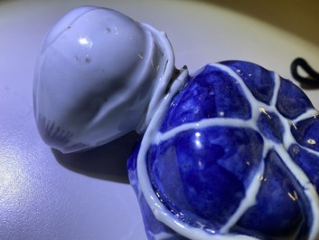 A Chinese blue, white and copper-red 'crab in lotus' water dropper, Kangxi