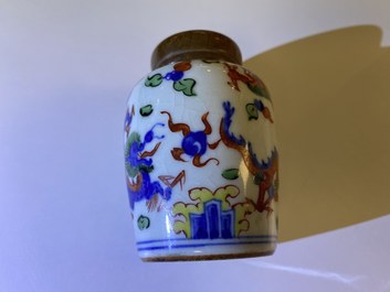 A Chinese doucai bowl, a famille verte spice box and a wucai tea caddy, Kangxi and later