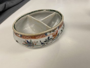 A Chinese doucai bowl, a famille verte spice box and a wucai tea caddy, Kangxi and later