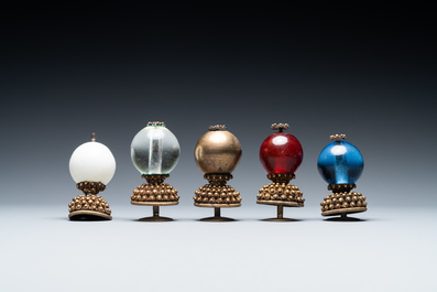 Five Chinese glass and gilt brass finials for Mandarin hats in their original boxes, 19th C.