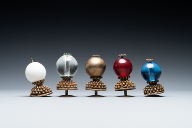 Five Chinese glass and gilt brass finials for Mandarin hats in their original boxes, 19th C.