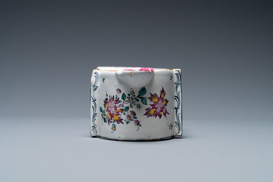 A polychrome French faience pocket watch holder, Marseille, 19th C.