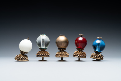 Five Chinese glass and gilt brass finials for Mandarin hats in their original boxes, 19th C.