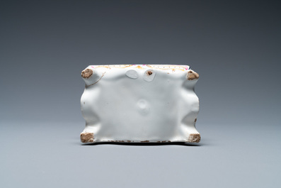 A polychrome French faience pocket watch holder, Marseille, 19th C.