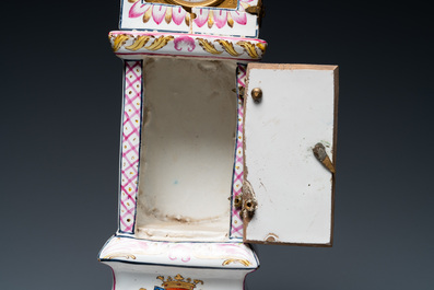 A polychrome French faience pocket watch holder, Marseille, 19th C.