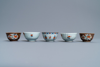 A Chinese Imari-style porringer, a mug, a bowl and five cups and saucers, Kangxi/Qianlong
