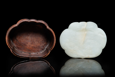 A Chinese wooden box with a white jade 'ruyi' plaque as cover, 18/19th C.