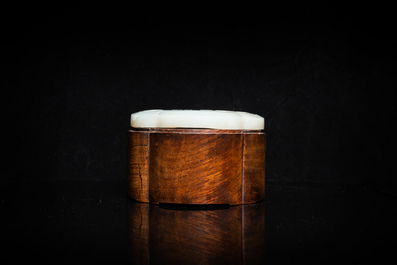 A Chinese wooden box with a white jade 'ruyi' plaque as cover, 18/19th C.