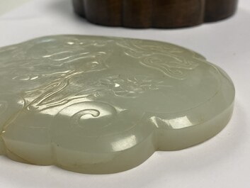 A Chinese wooden box with a white jade 'ruyi' plaque as cover, 18/19th C.