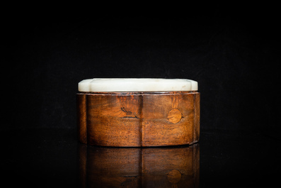 A Chinese wooden box with a white jade 'ruyi' plaque as cover, 18/19th C.