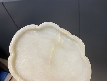 A Chinese wooden box with a white jade 'ruyi' plaque as cover, 18/19th C.
