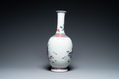 A Chinese blue, white and copper red 'antiquities' bottle vase, Qianlong