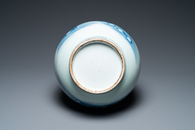 A Chinese blue, white and copper-red bottle vase with Buddhist lions, 20th C.