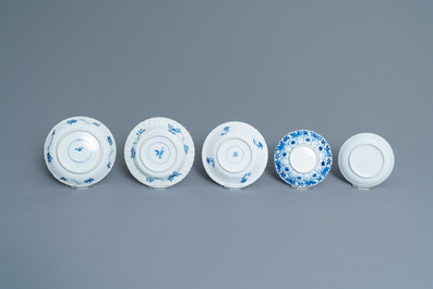 Twenty-one Chinese blue and white saucers and eighteen cups, Kangxi