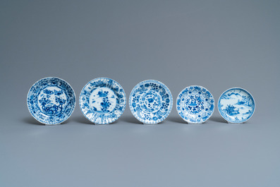 Twenty-one Chinese blue and white saucers and eighteen cups, Kangxi