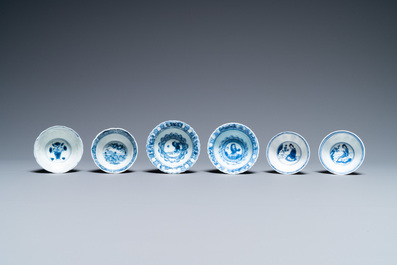 Nineteen Chinese blue and white saucers and twelve cups, Kangxi