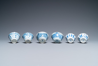 Nineteen Chinese blue and white saucers and twelve cups, Kangxi