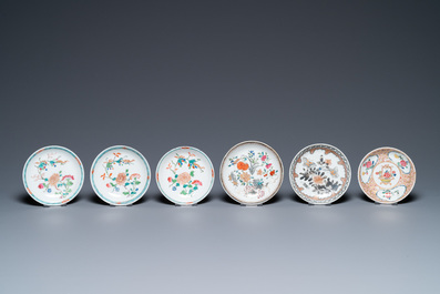 A varied collection of Chinese famille rose and grisaille cups and saucers and a 'rooster' bowl, Yongzheng/Qianlong