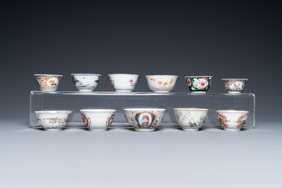 A varied collection of Chinese famille rose and grisaille cups and saucers and a 'rooster' bowl, Yongzheng/Qianlong