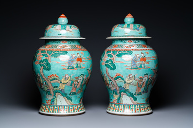 A pair of large Chinese turquoise-ground famille verte vases and covers, 19th C.