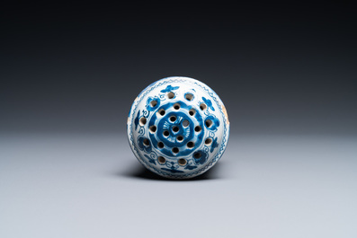 A Dutch Delft blue and white tripod caster with birds near blossoms, 1st half 18th C.