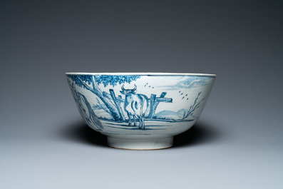 A large Dutch Delft blue and white bowl with shepherds on horsebacks, 18th C.