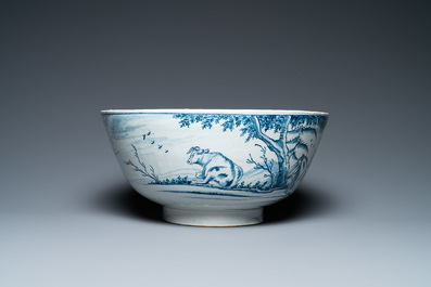 A large Dutch Delft blue and white bowl with shepherds on horsebacks, 18th C.