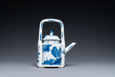 A Chinese blue and white arch-handled teapot and cover, Kangxi