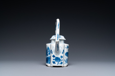 A Chinese blue and white arch-handled teapot and cover, Kangxi
