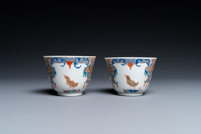 A pair of Chinese famille rose cups and saucers with aquatic birds, Qianlong