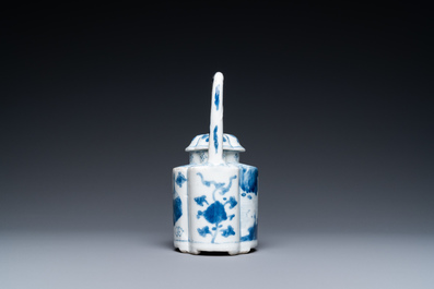 A Chinese blue and white arch-handled teapot and cover, Kangxi