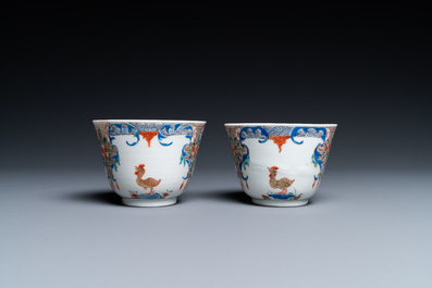 A pair of Chinese famille rose cups and saucers with aquatic birds, Qianlong