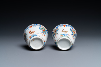 A pair of Chinese famille rose cups and saucers with aquatic birds, Qianlong